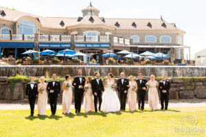 wedding bridal party with saratoga national in the background
